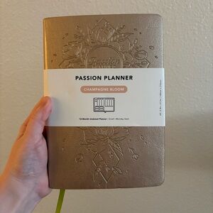 12-month undated planner in the "Champagne Bloom" design by Passion Planner A5